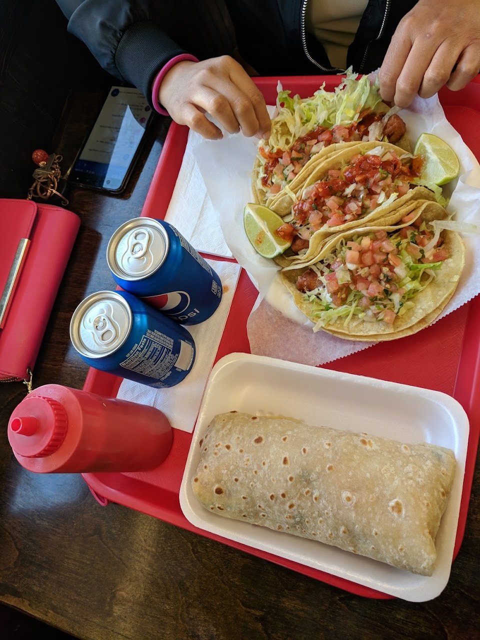Mexican favorites listed on a large menu board.